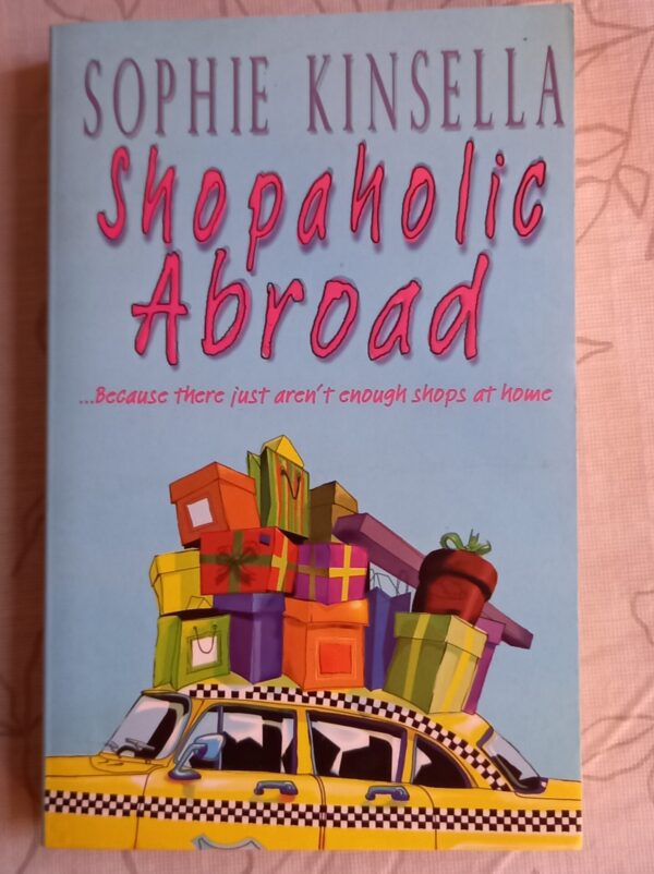 Shopaholic Abroad - Sophie Kinsella. This is a used book.